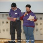 Two people speaking at the self-advocacy meeting in Israel