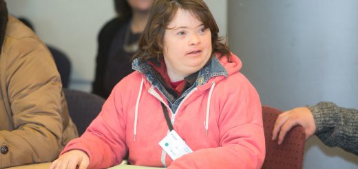 A young lady speaking at the self-advocacy meeting in Israel